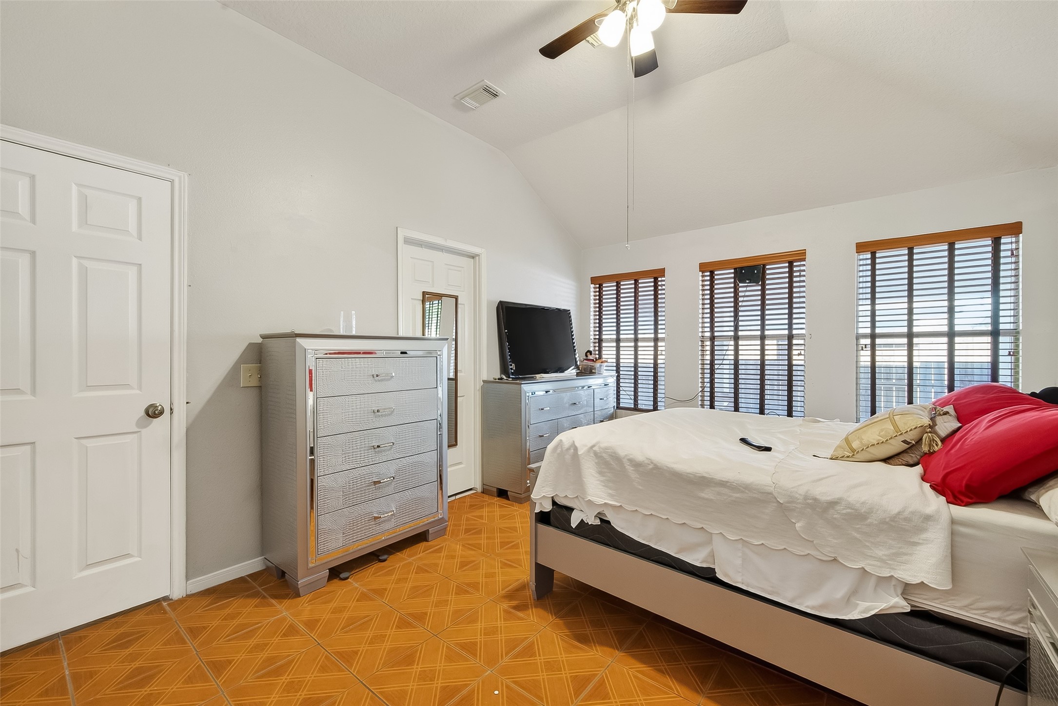 19322 Dawn Canyon Road Houston, TX 77084 - Photo 24 of 33 a bedroom with a bed and a flat tv screen