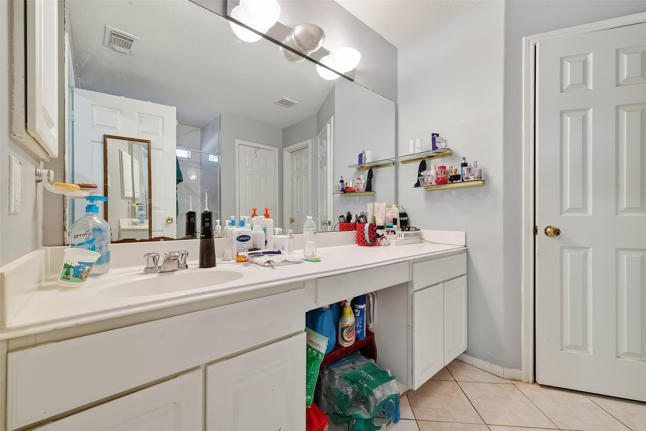 19322 Dawn Canyon Road Houston, TX 77084 - Photo 25 of 33 a bathroom with a sink and a mirror
