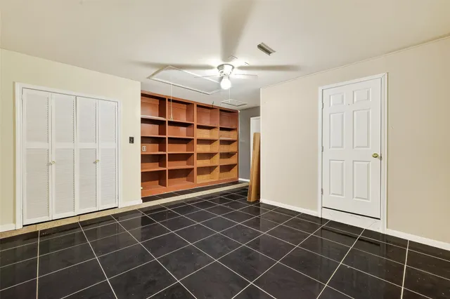 an empty room with a empty space and windows