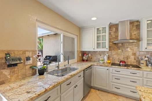 a kitchen with sink stove and cabinets