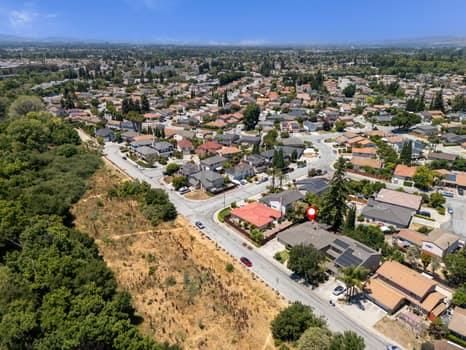 an aerial view of residential houses with outdoor space