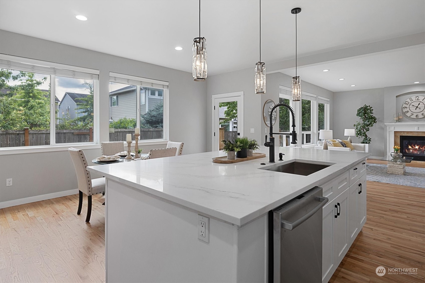 3622 222nd Place Southeast Bothell, WA 98021 - Photo 13 of 40 a large kitchen with a counter space a sink appliances and a large window