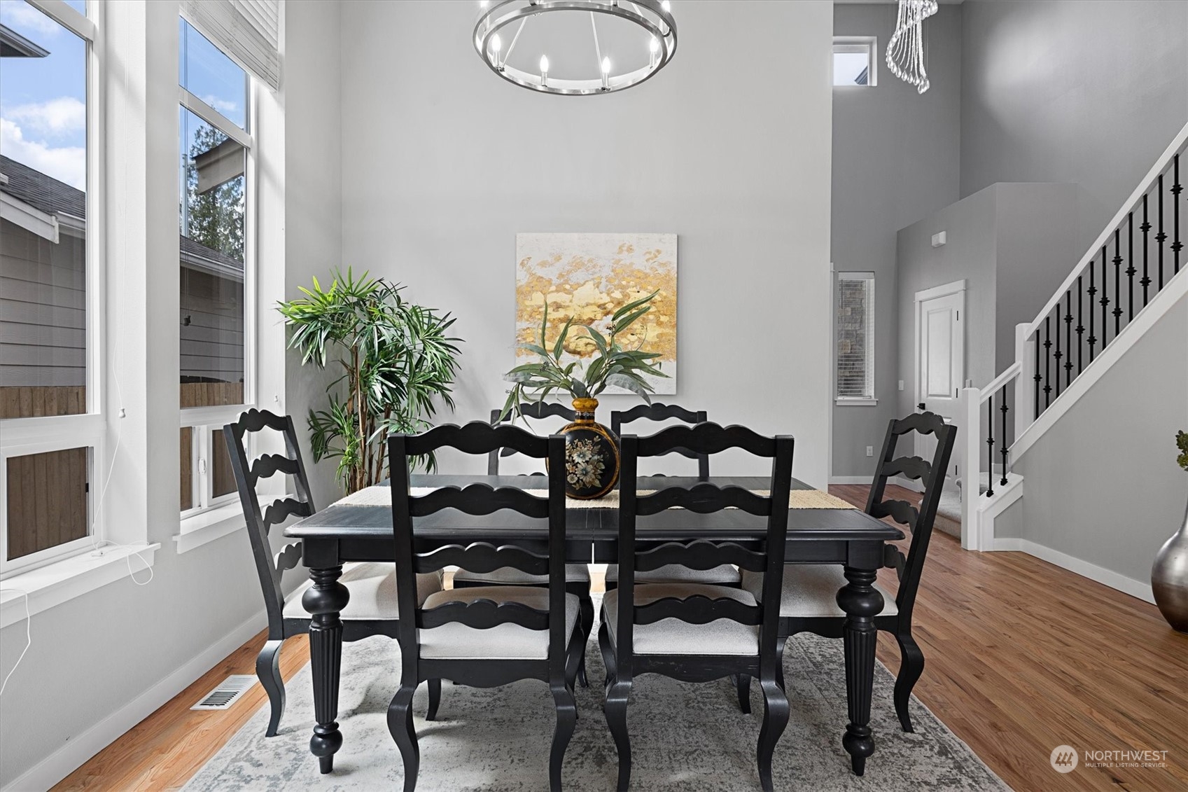 3622 222nd Place Southeast Bothell, WA 98021 - Photo 16 of 40 a view of a dining room with furniture and wooden floor