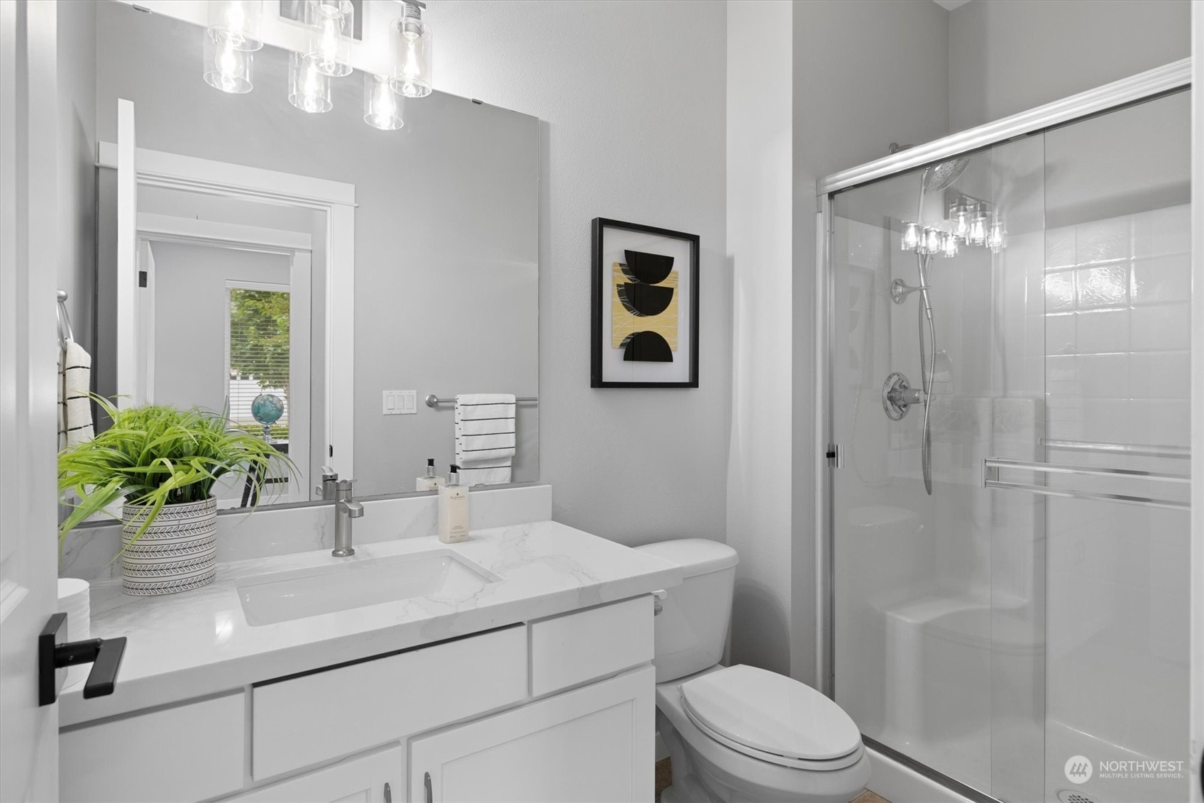 3622 222nd Place Southeast Bothell, WA 98021 - Photo 19 of 40 a bathroom with a sink a toilet a large mirror and shower