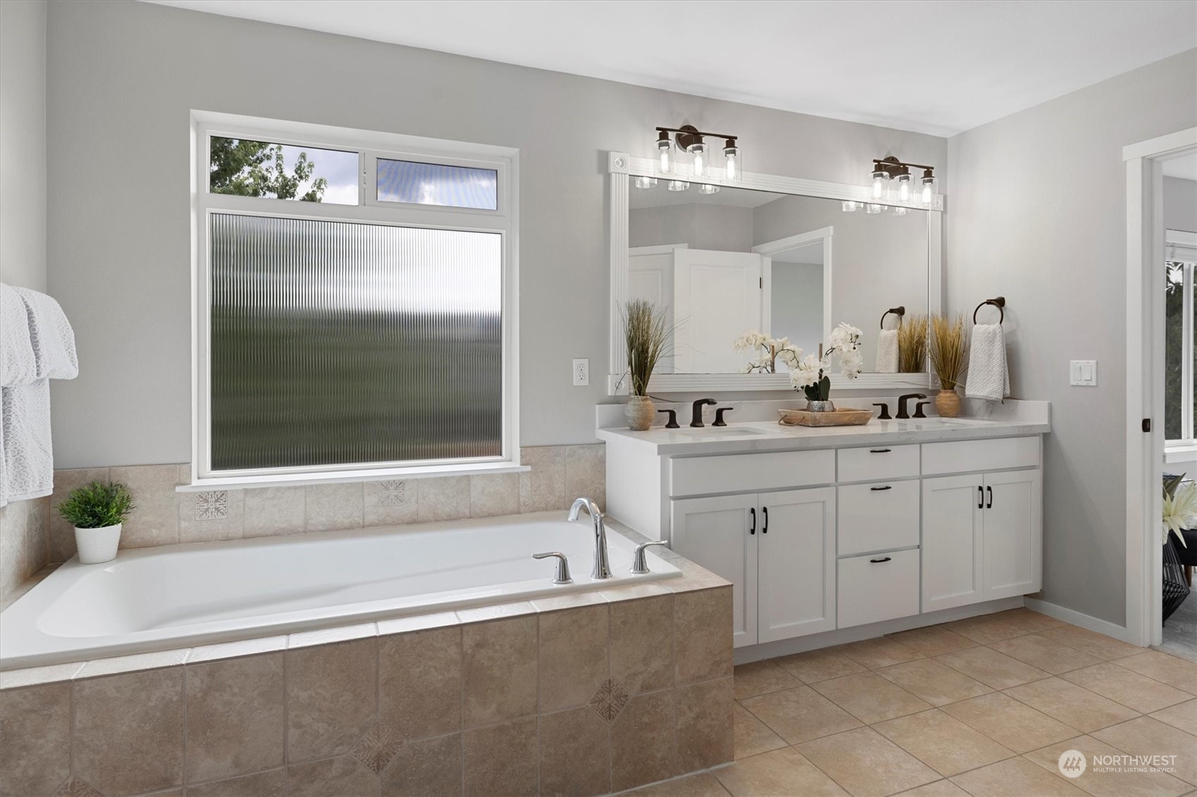 3622 222nd Place Southeast Bothell, WA 98021 - Photo 29 of 40 a bathroom with a tub sink and mirror