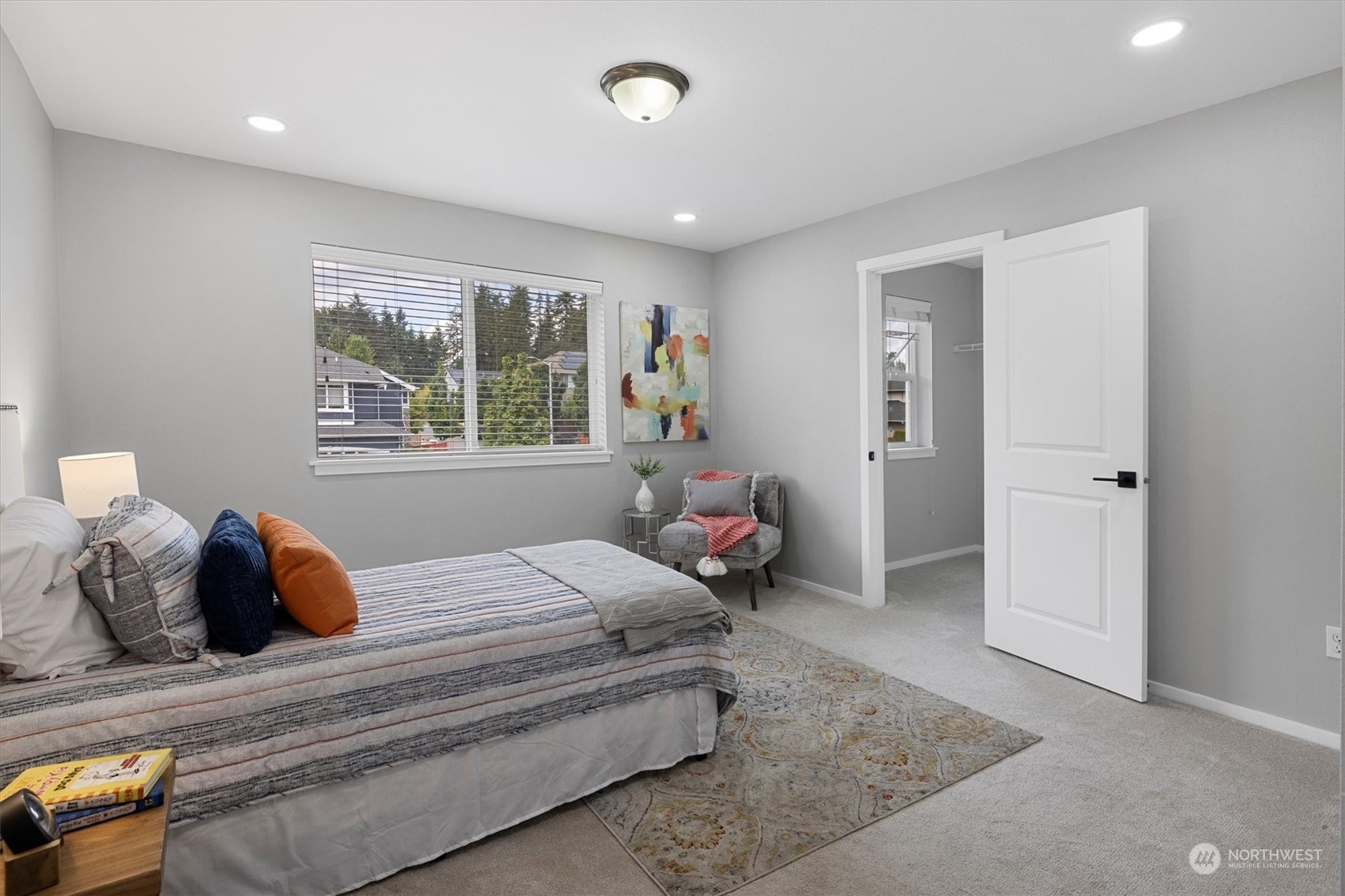 3622 222nd Place Southeast Bothell, WA 98021 - Photo 33 of 40 a bedroom with a bed and wooden floor