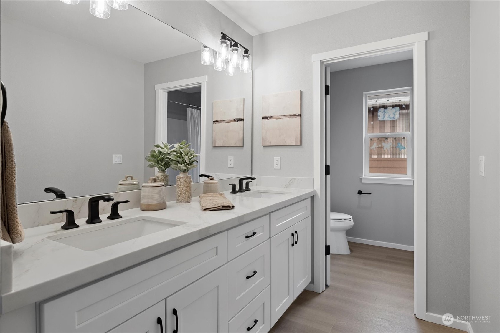 3622 222nd Place Southeast Bothell, WA 98021 - Photo 35 of 40 a bathroom with a double vanity sink mirror and toilet