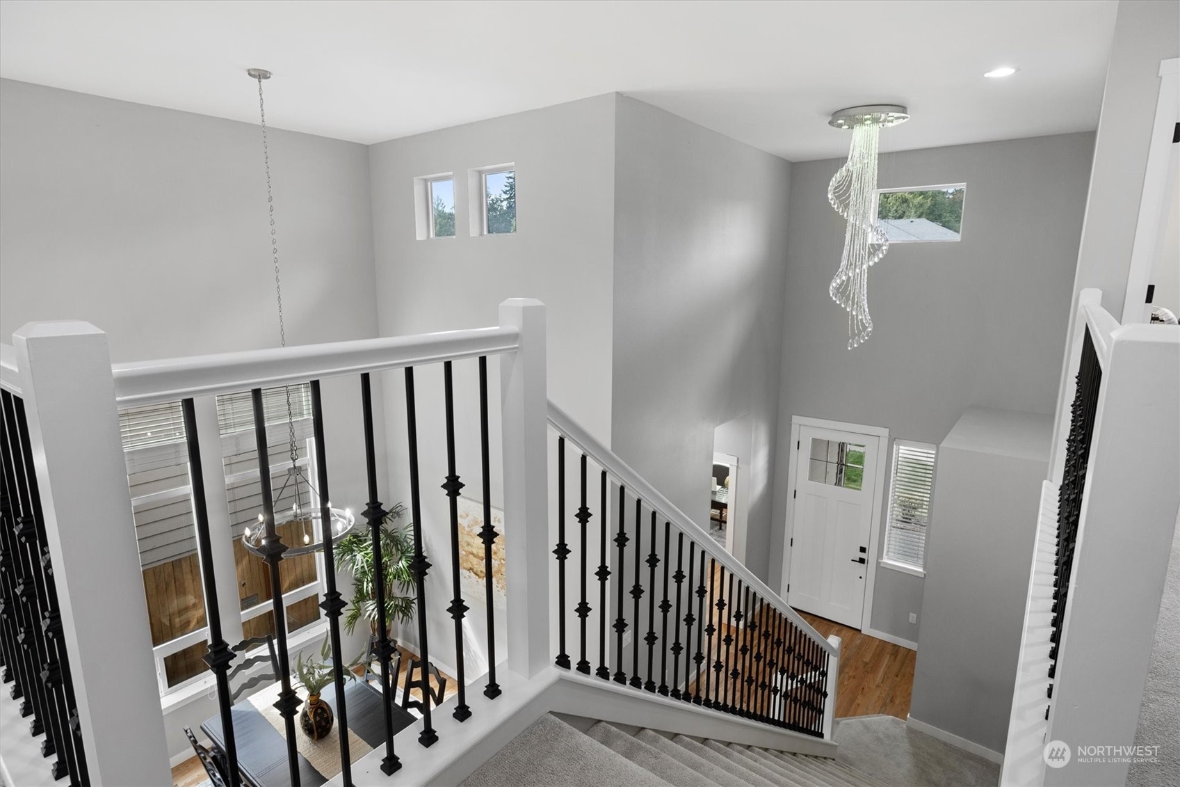 3622 222nd Place Southeast Bothell, WA 98021 - Photo 5 of 40 a view of a hallway with wooden floor and stairs