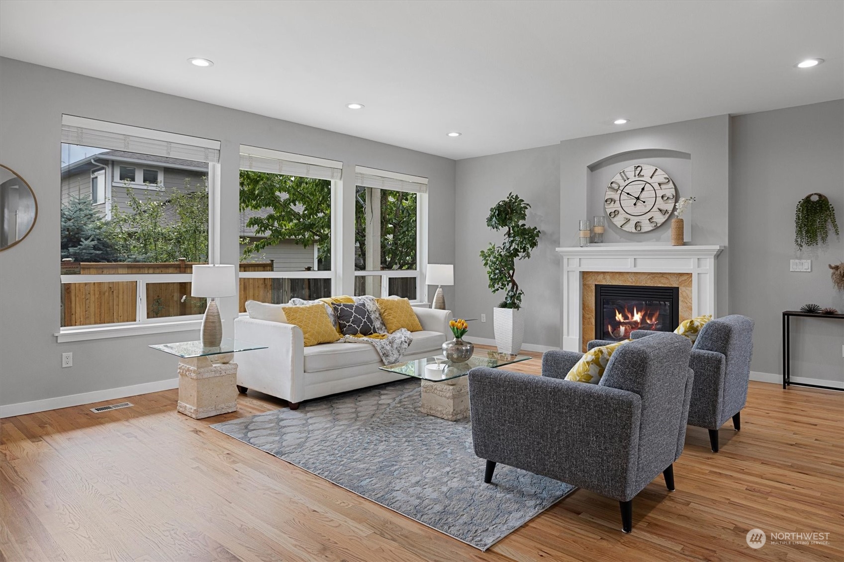 3622 222nd Place Southeast Bothell, WA 98021 - Photo 9 of 40 a living room with furniture large window and fireplace