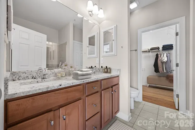 a bathroom with a sink double vanity and a mirror