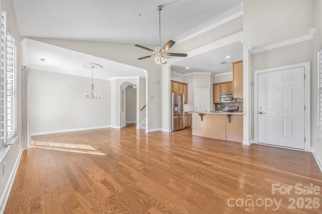 a view of a kitchen with a sink and a window