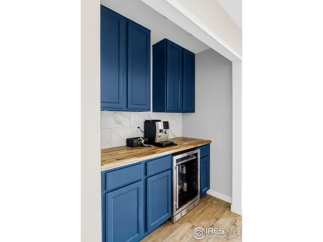 a view of a dining room with furniture and window