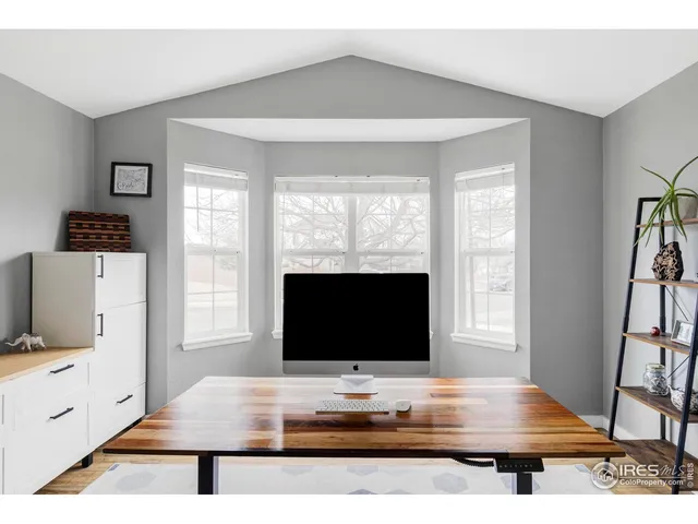 a room with furniture and flat screen tv