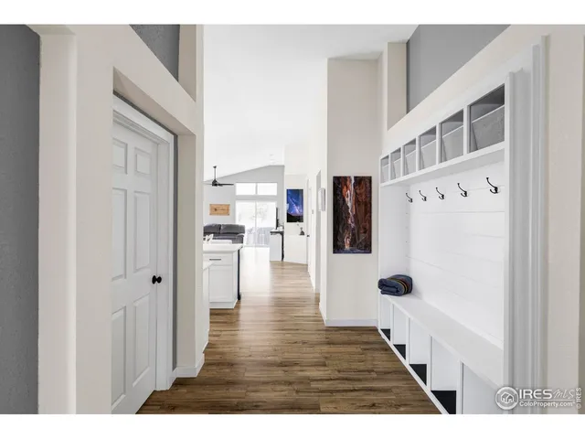 a view of a living room with furniture and wooden floor