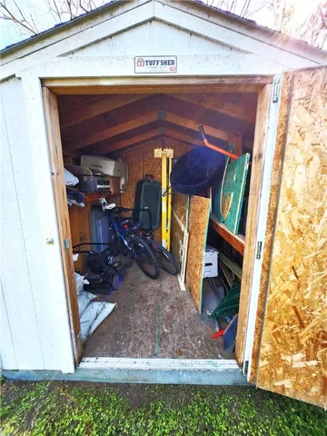 a view of a small house with a small yard