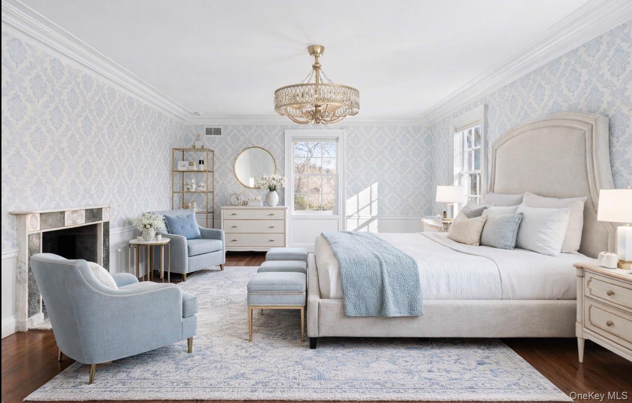 393 Mill River Road Muttontown, NY 11771 - Photo 16 of 41 a living room with furniture chandelier and fireplace