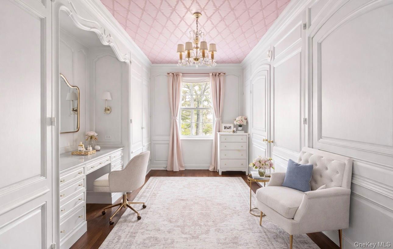 393 Mill River Road Muttontown, NY 11771 - Photo 18 of 41 a living room with furniture and a chandelier