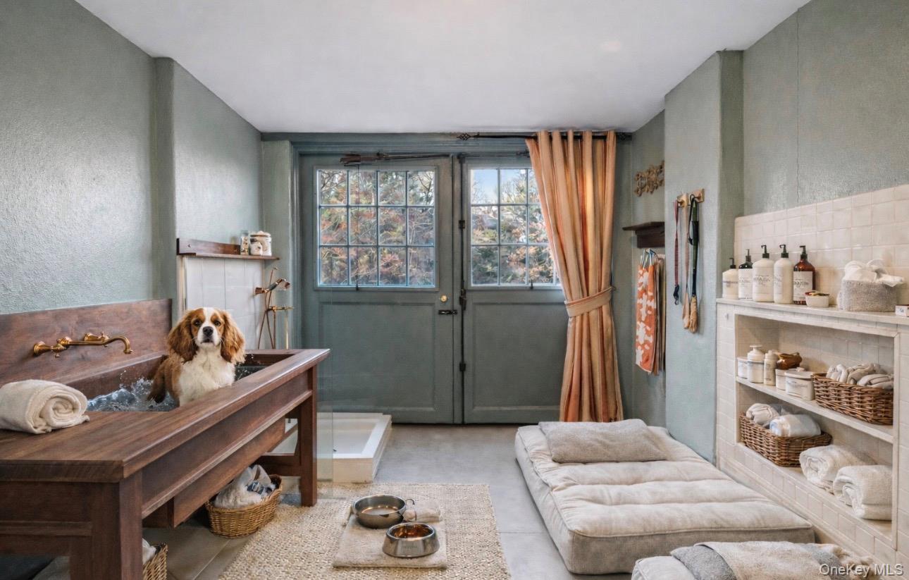 393 Mill River Road Muttontown, NY 11771 - Photo 24 of 41 a living room with furniture and a window