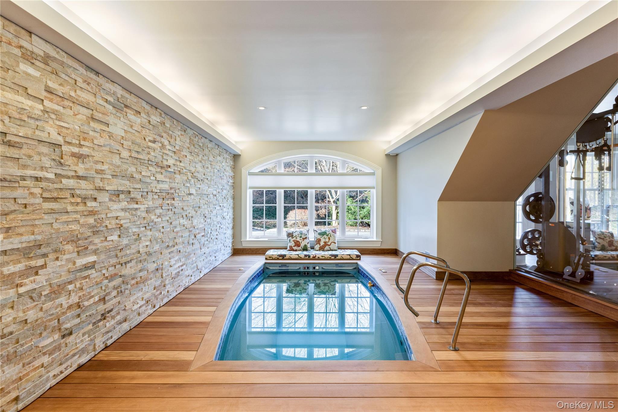 393 Mill River Road Muttontown, NY 11771 - Photo 25 of 41 a living room with furniture a window and a fireplace