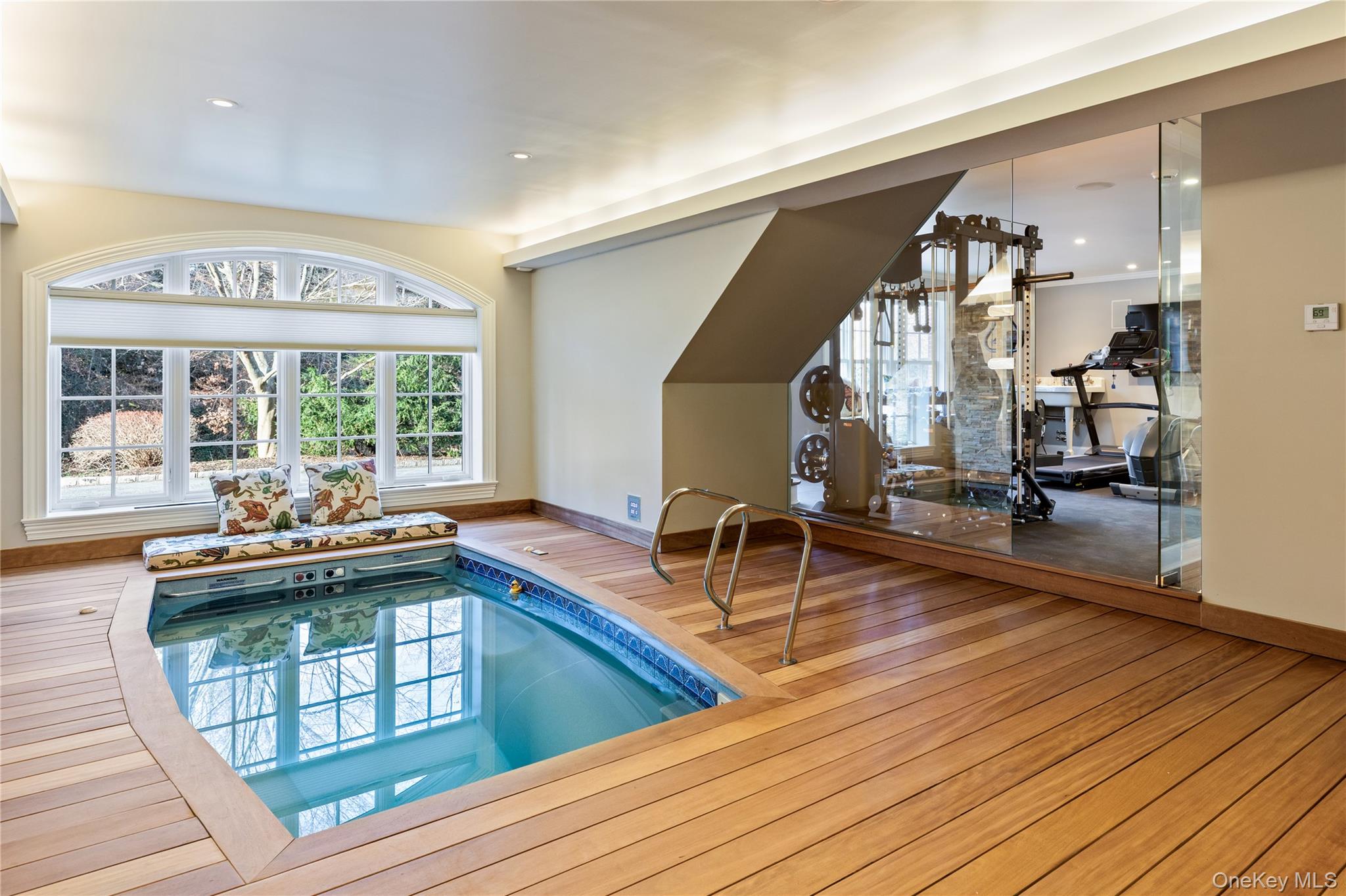 393 Mill River Road Muttontown, NY 11771 - Photo 26 of 41 a living room with furniture a wooden floor and next to a window