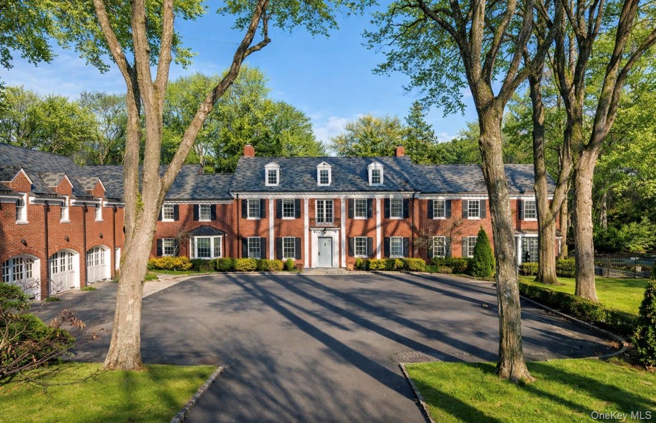 393 Mill River Road Muttontown, NY 11771 - Photo 3 of 41 a view of a house with a yard