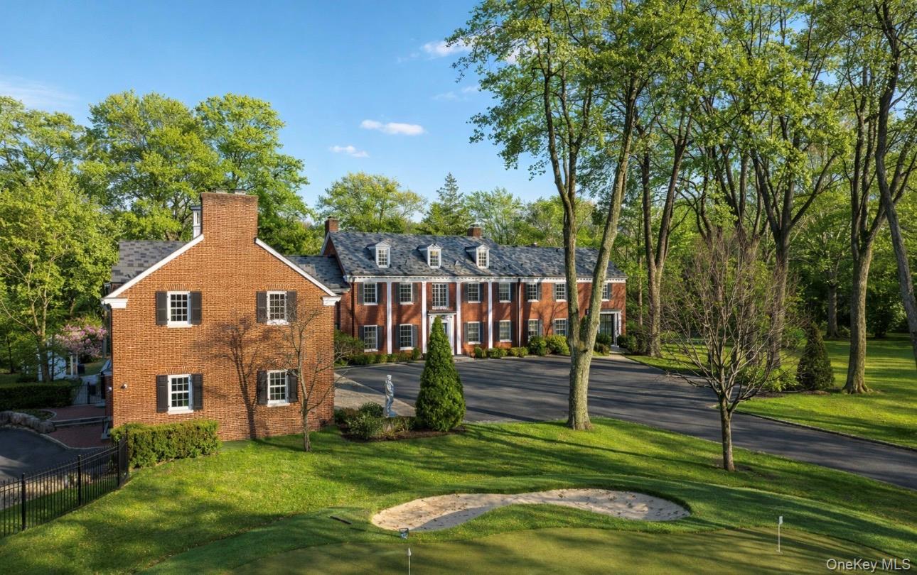 393 Mill River Road Muttontown, NY 11771 - Photo 35 of 41 a view of a house with a yard