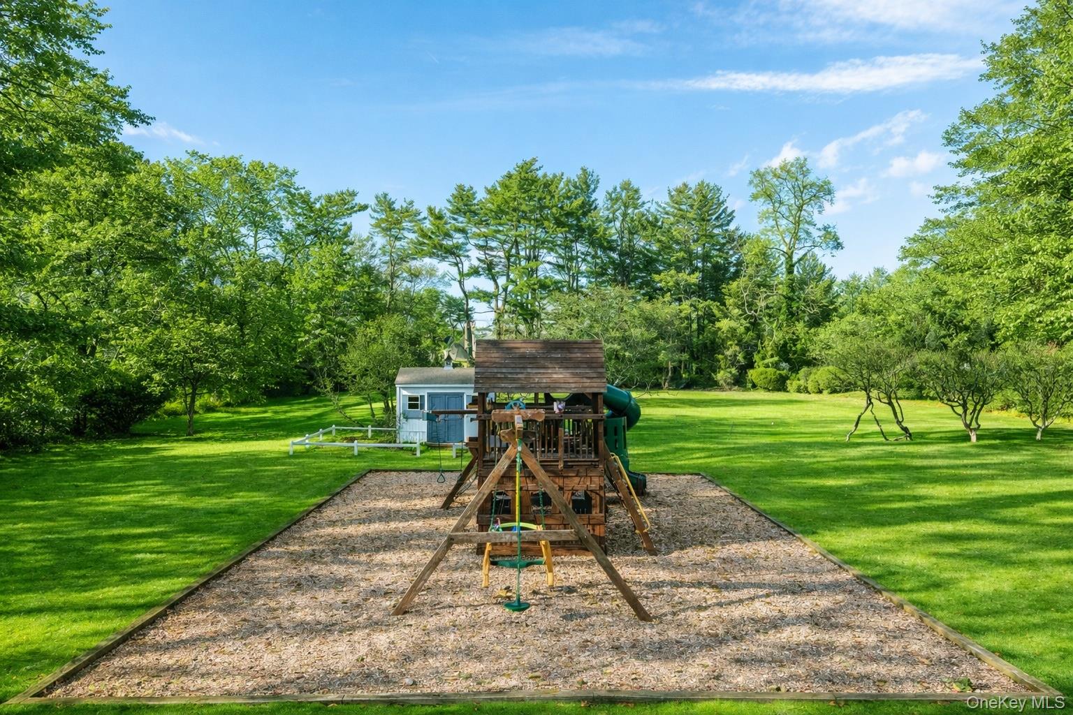 393 Mill River Road Muttontown, NY 11771 - Photo 37 of 41 a view of a park with a slide