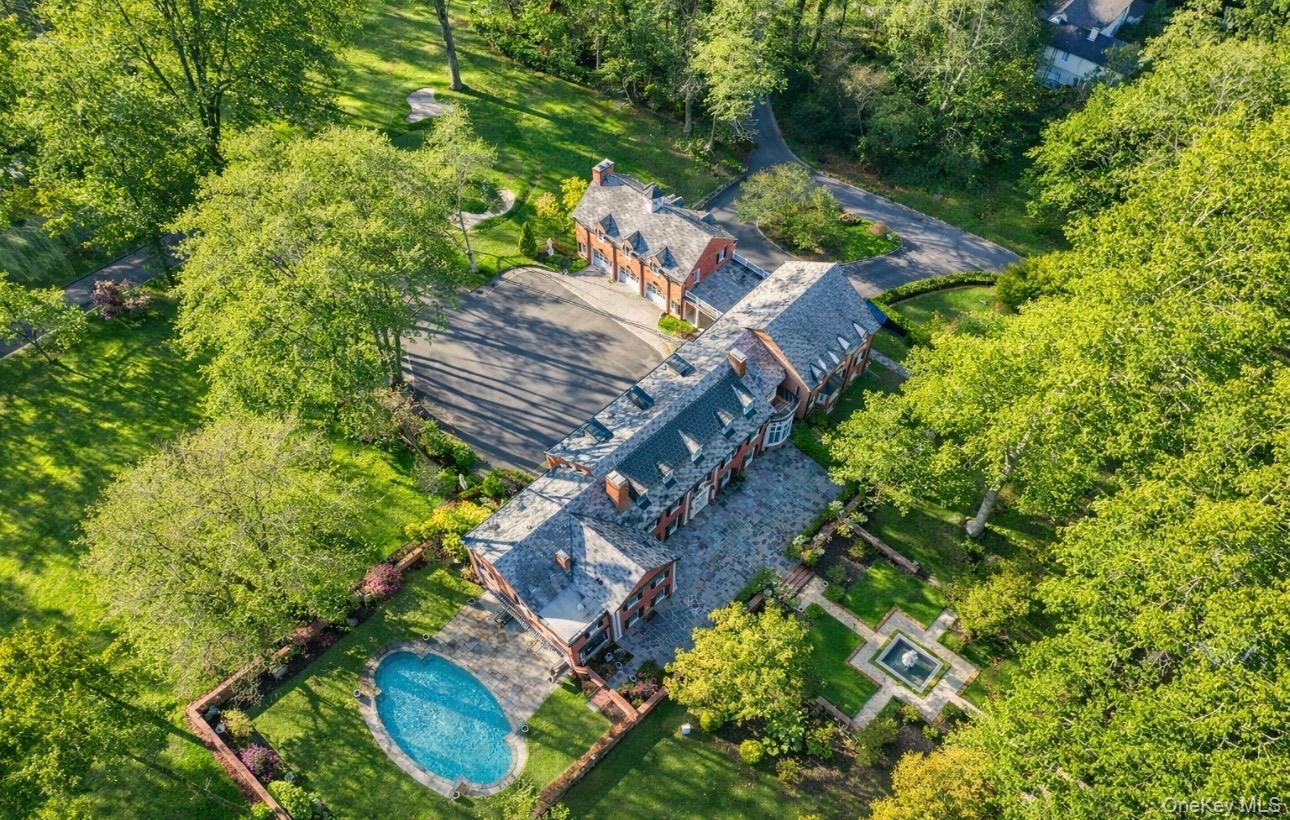 393 Mill River Road Muttontown, NY 11771 - Photo 41 of 41 an aerial view of a house with a yard