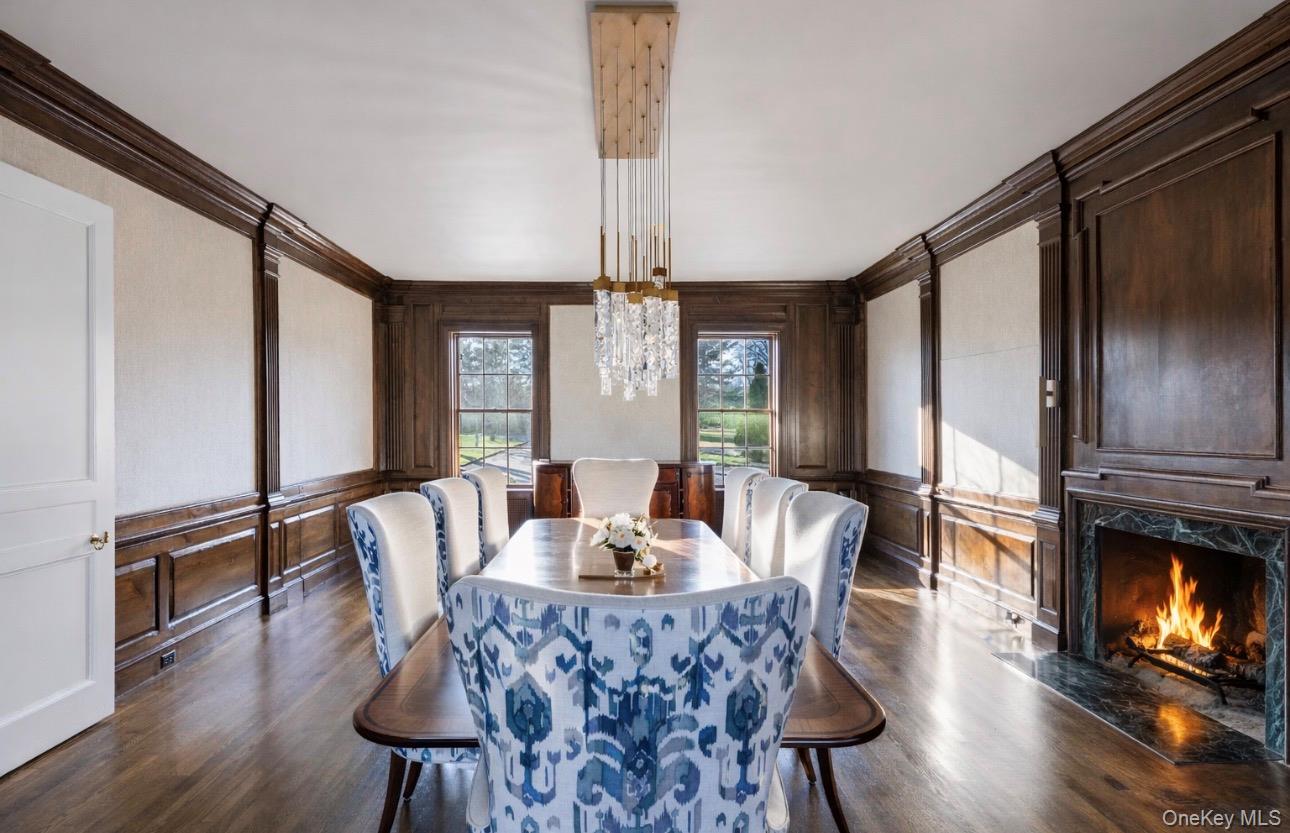 393 Mill River Road Muttontown, NY 11771 - Photo 7 of 41 a view of a dining room with furniture window and wooden floor