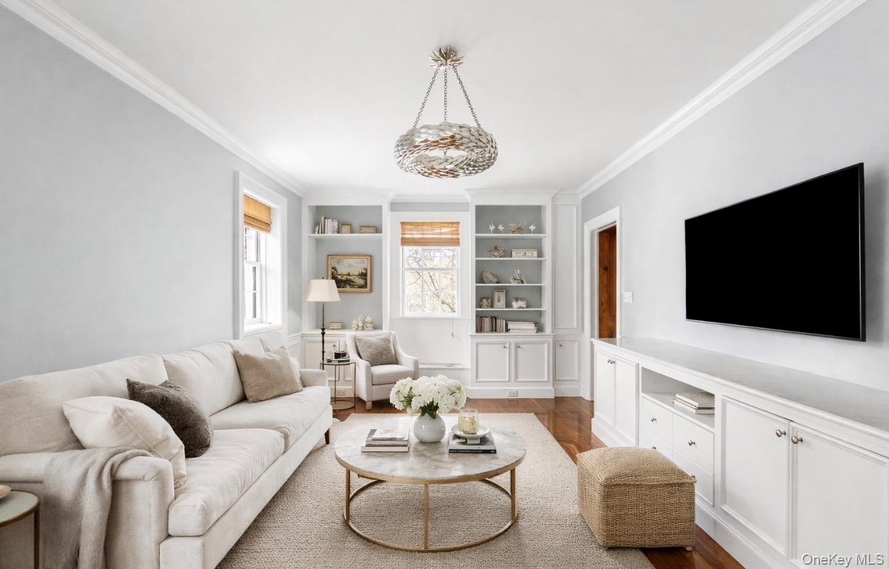 393 Mill River Road Muttontown, NY 11771 - Photo 10 of 41 a living room with furniture and a flat screen tv