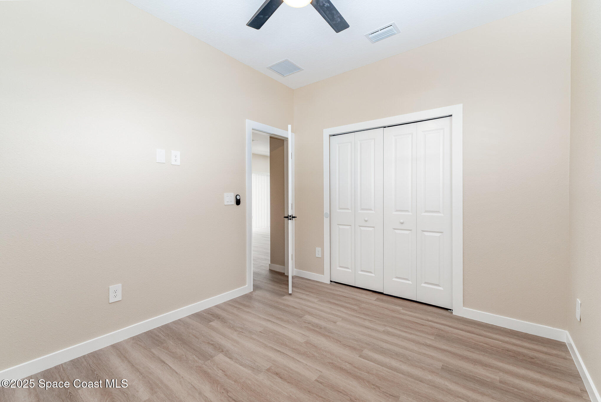 15615 Southwest 49th Avenue Road Ocala, FL 34473 - Photo 11 of 23 an empty room with closet and windows