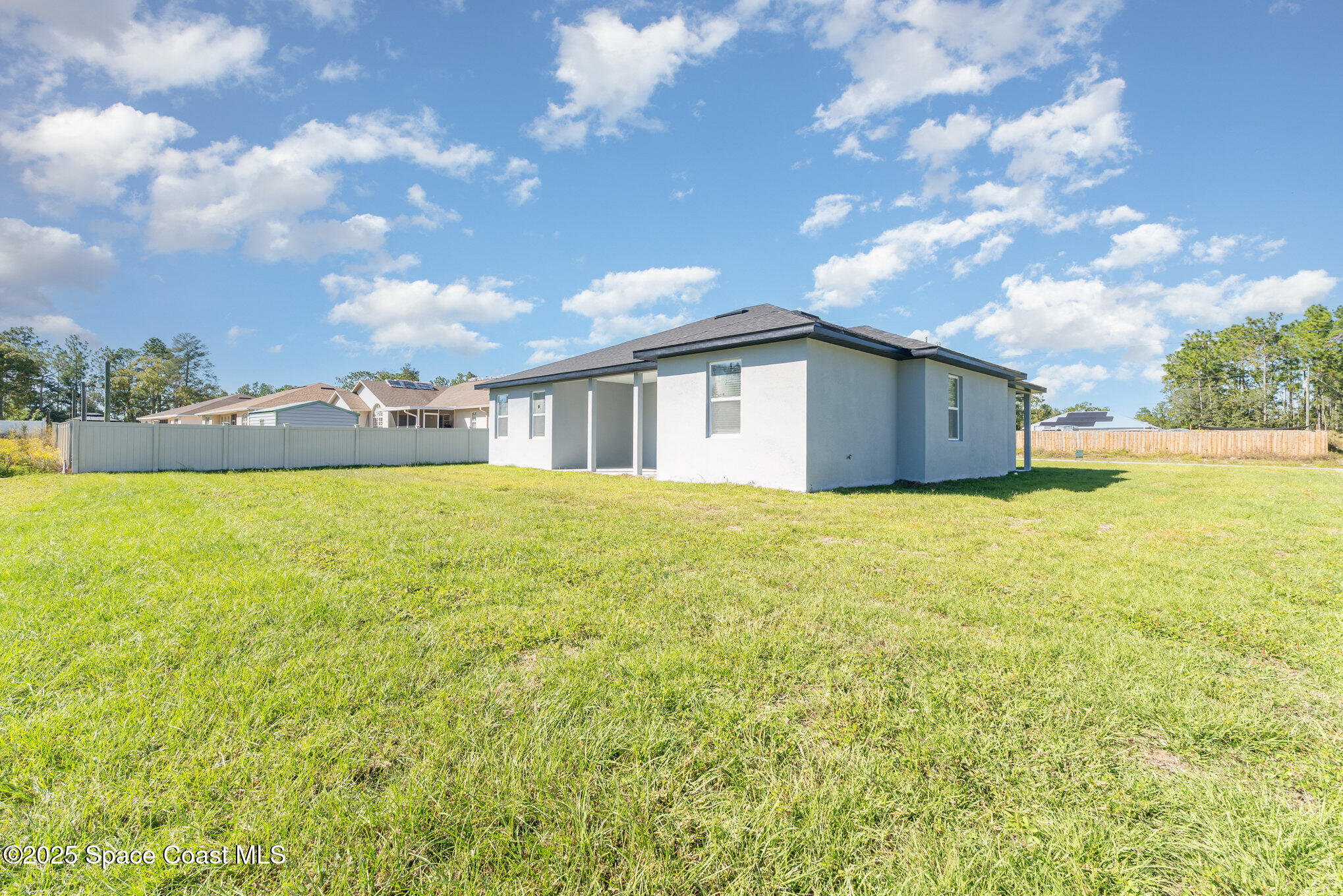 15615 Southwest 49th Avenue Road Ocala, FL 34473 - Photo 20 of 23 a view of a house with a yard and sitting area