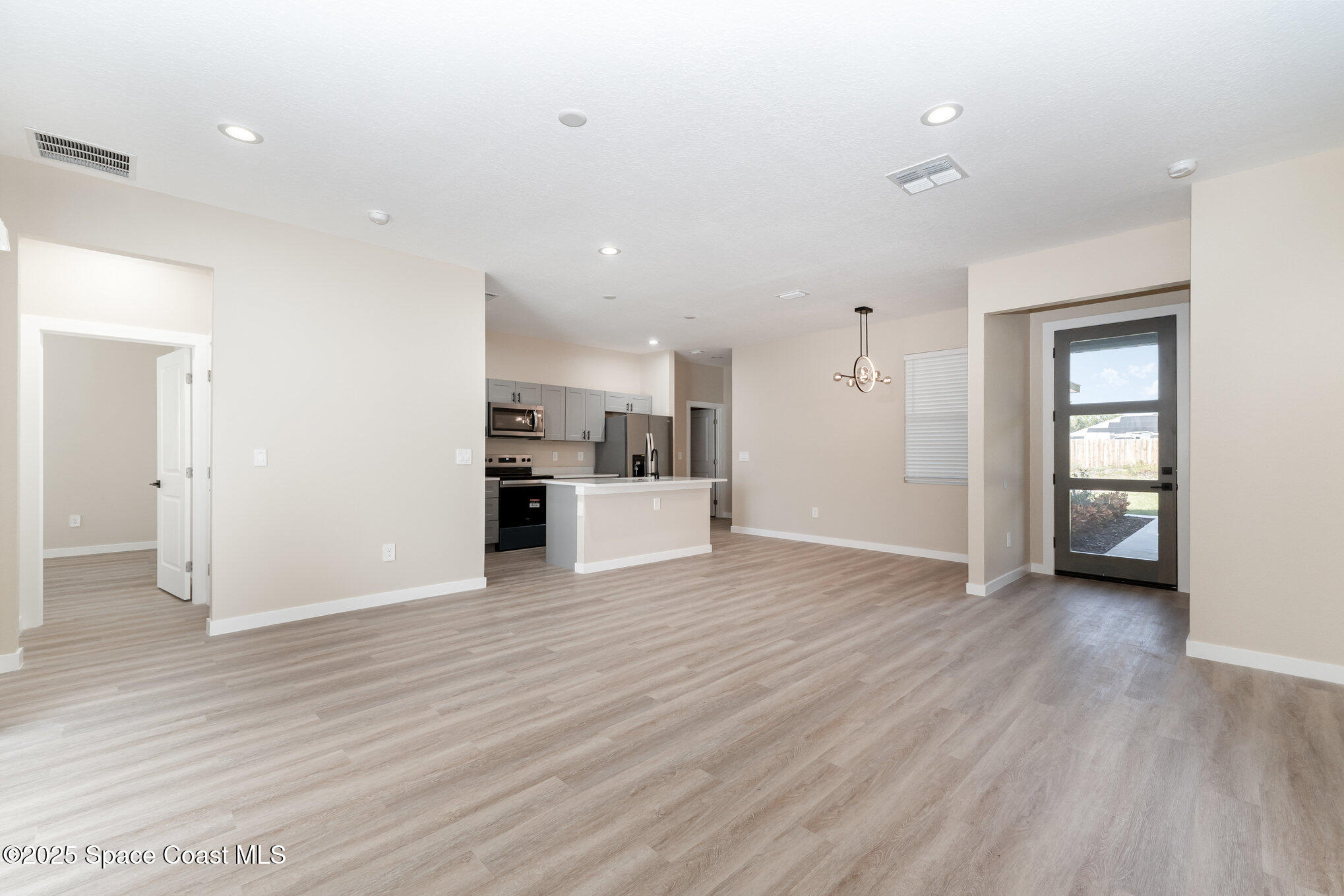 15615 Southwest 49th Avenue Road Ocala, FL 34473 - Photo 2 of 23 a view of a kitchen with wooden floor and a kitchen