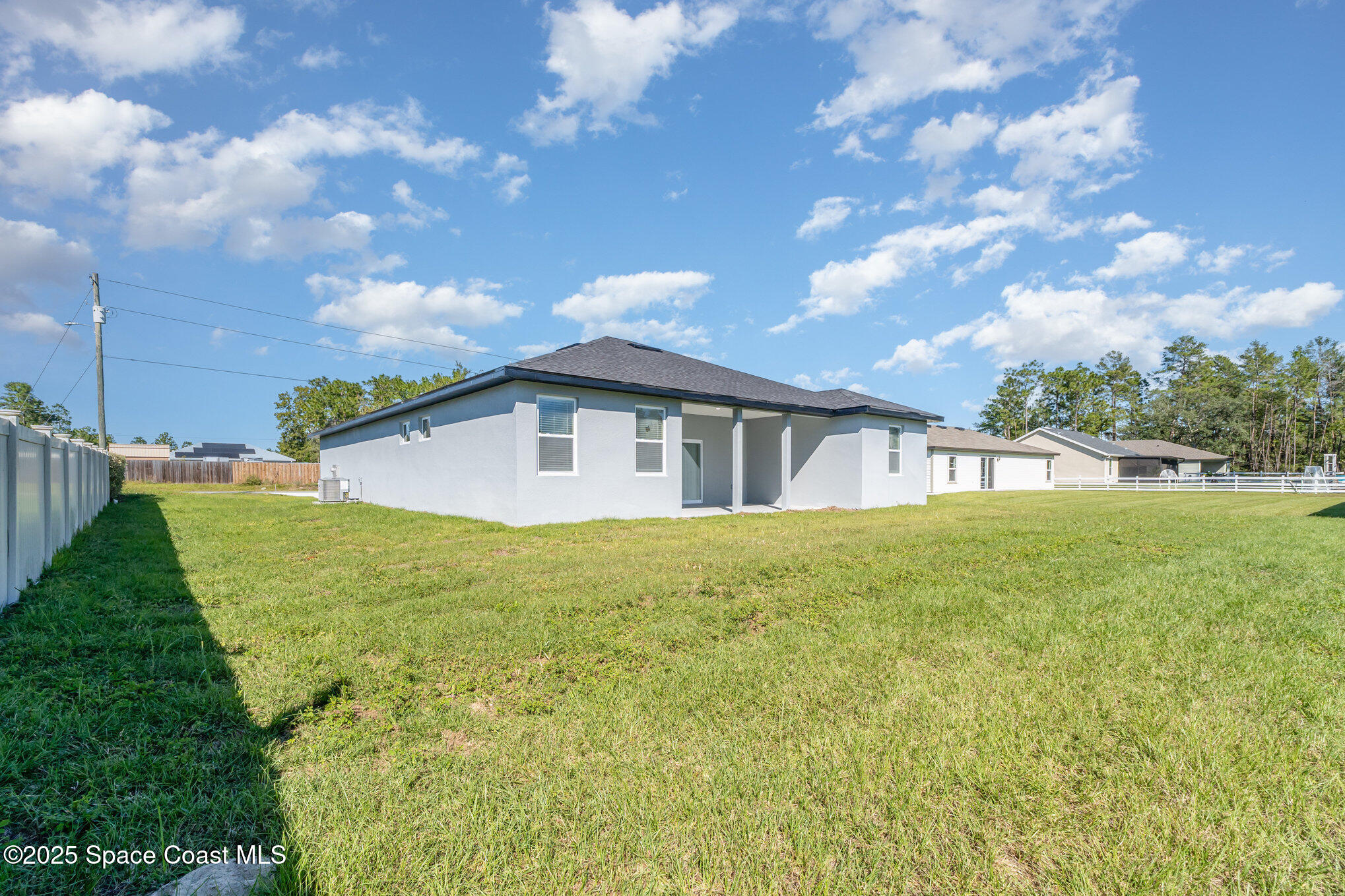 15615 Southwest 49th Avenue Road Ocala, FL 34473 - Photo 23 of 23 a view of a house with a backyard
