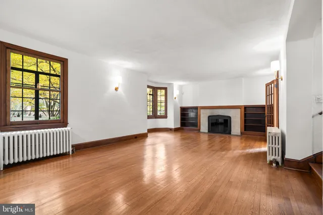 a kitchen with granite countertop a stove a sink and a microwave