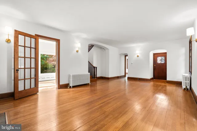a kitchen with granite countertop a sink window and cabinets