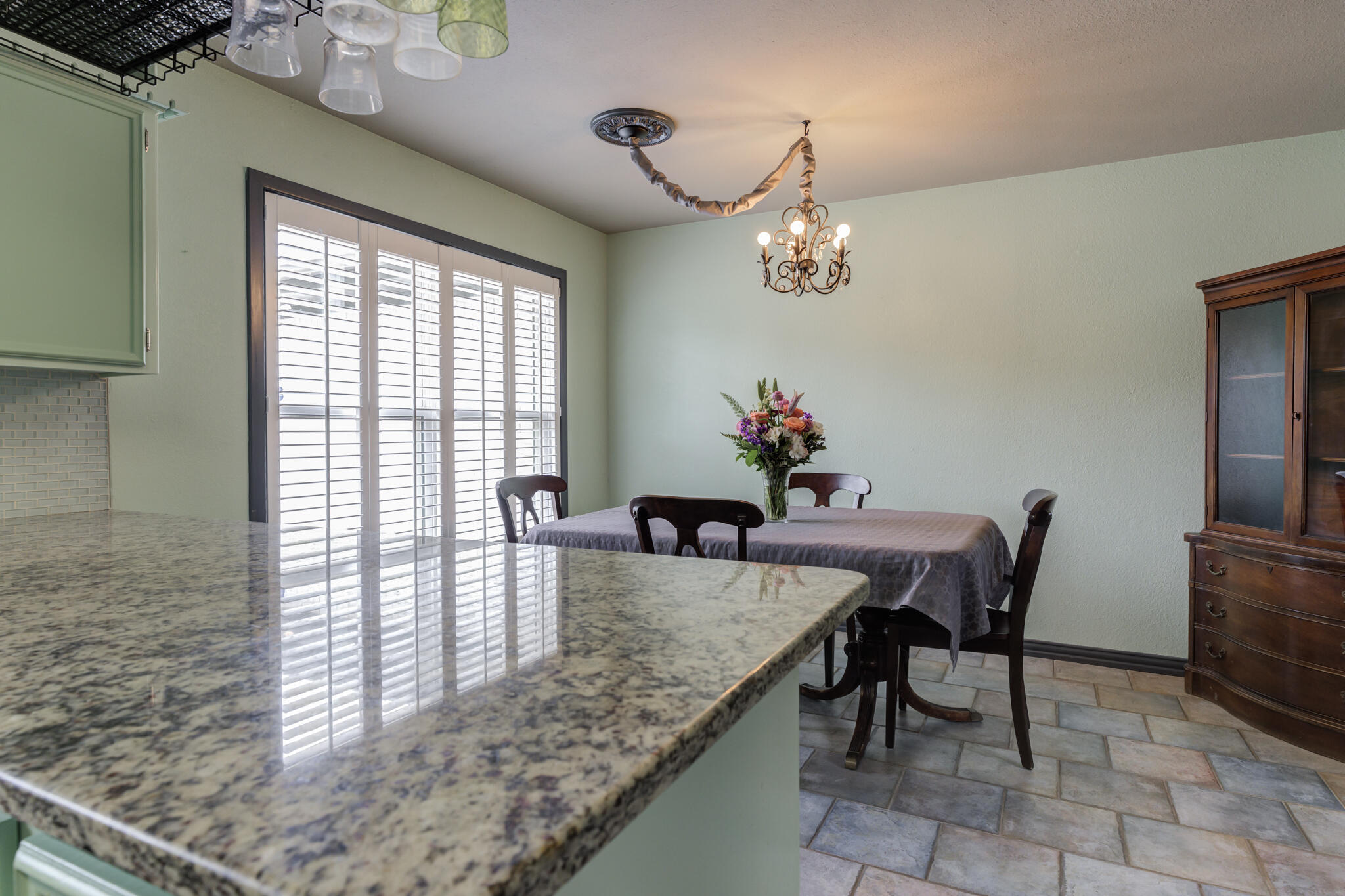 2608 74th Place Lubbock, TX 79423 - Photo 12 of 38 a dining room with furniture and window