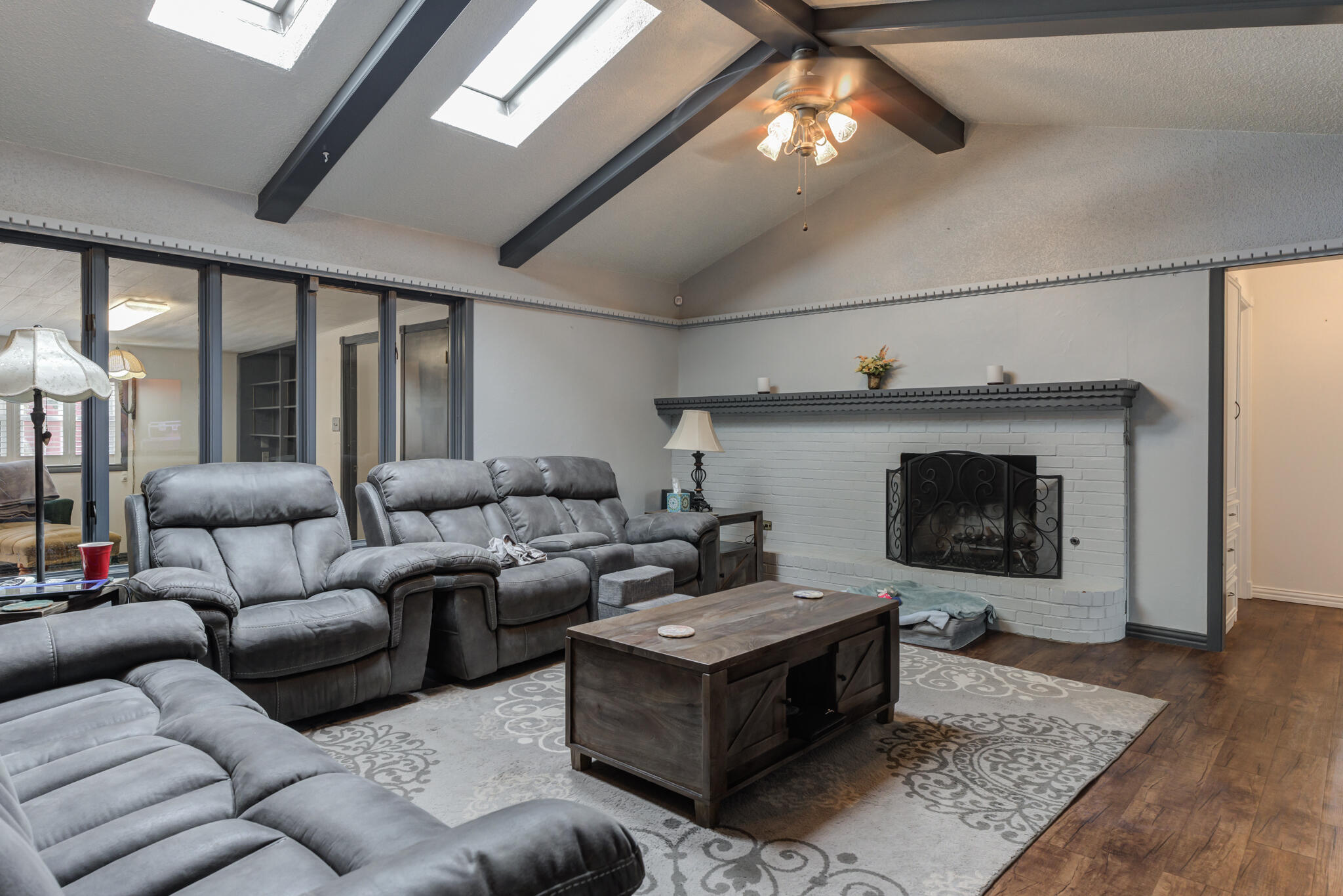 2608 74th Place Lubbock, TX 79423 - Photo 16 of 38 a living room with furniture and a fireplace