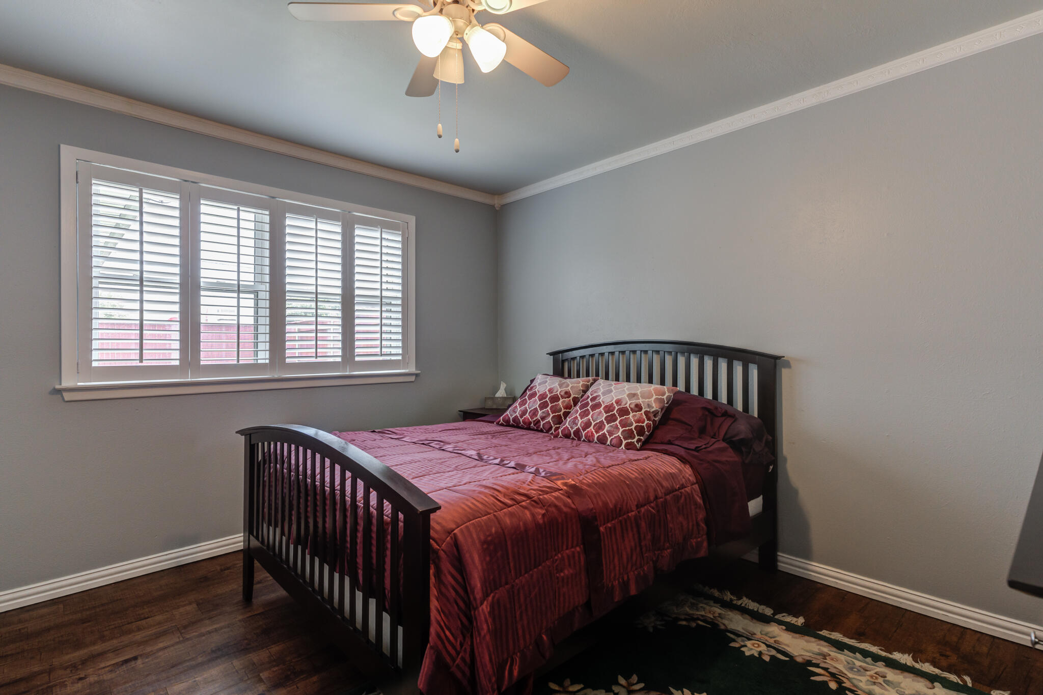2608 74th Place Lubbock, TX 79423 - Photo 25 of 38 a bedroom with a bed and a window