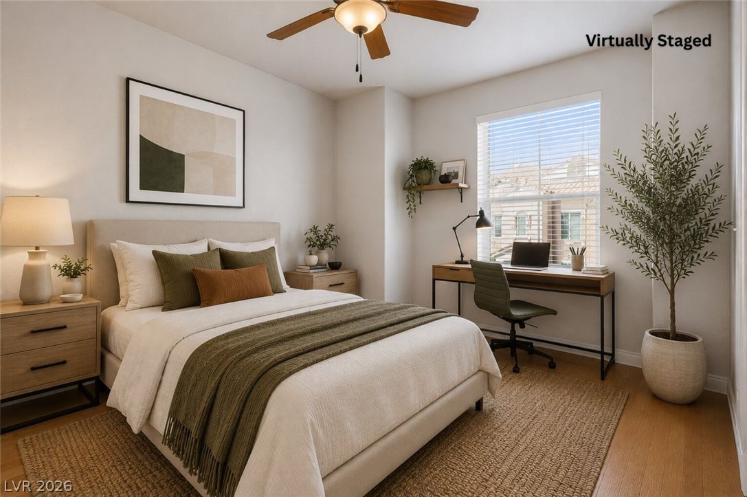 10550 West Alexander Road, Unit 2133 Las Vegas, NV 89129 - Photo 9 of 42 This tranquil bedroom offers comfort and a dedicated workspace for focused living.
