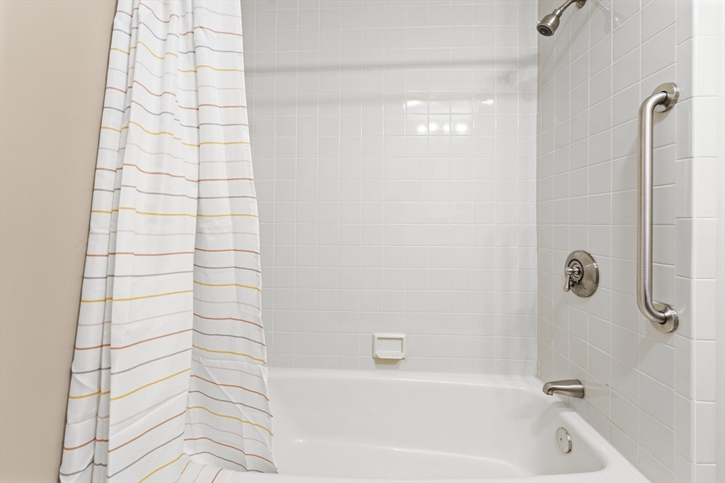 1 Colonial Drive, Unit C16 Andover, MA 01810 - Photo 17 of 32 a bathroom with a bathtub and shower