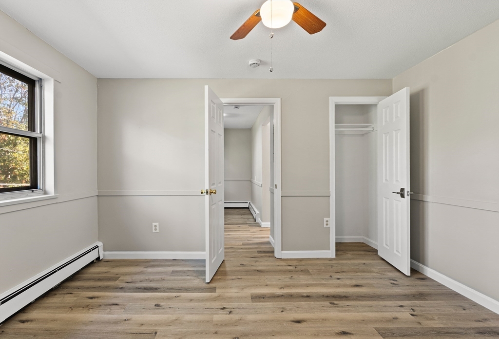 1 Colonial Drive, Unit C16 Andover, MA 01810 - Photo 22 of 32 a view of empty room with wooden floor