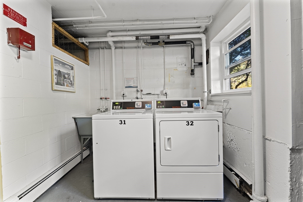 1 Colonial Drive, Unit C16 Andover, MA 01810 - Photo 27 of 32 a utility room with dryer and washer