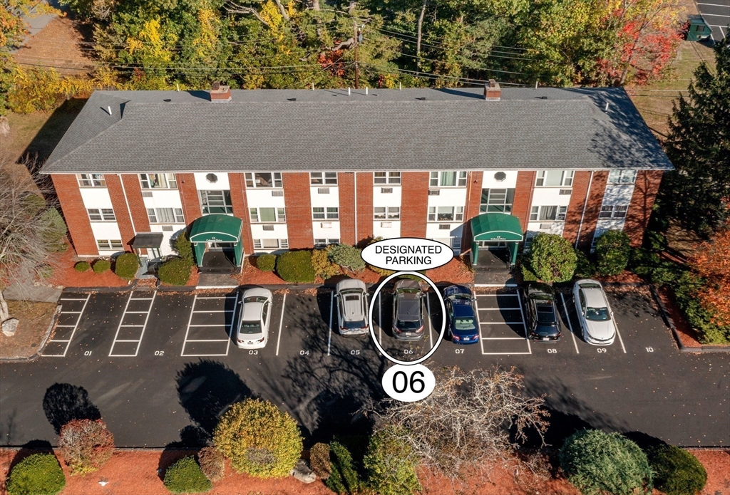 1 Colonial Drive, Unit C16 Andover, MA 01810 - Photo 29 of 32 a backyard of a house with yard and outdoor seating