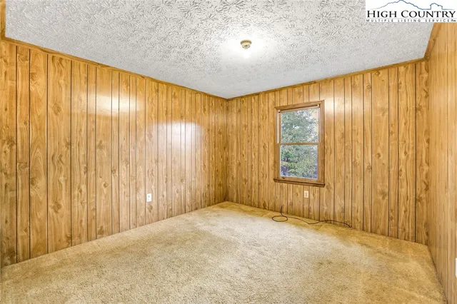 a view of a room with wooden walls