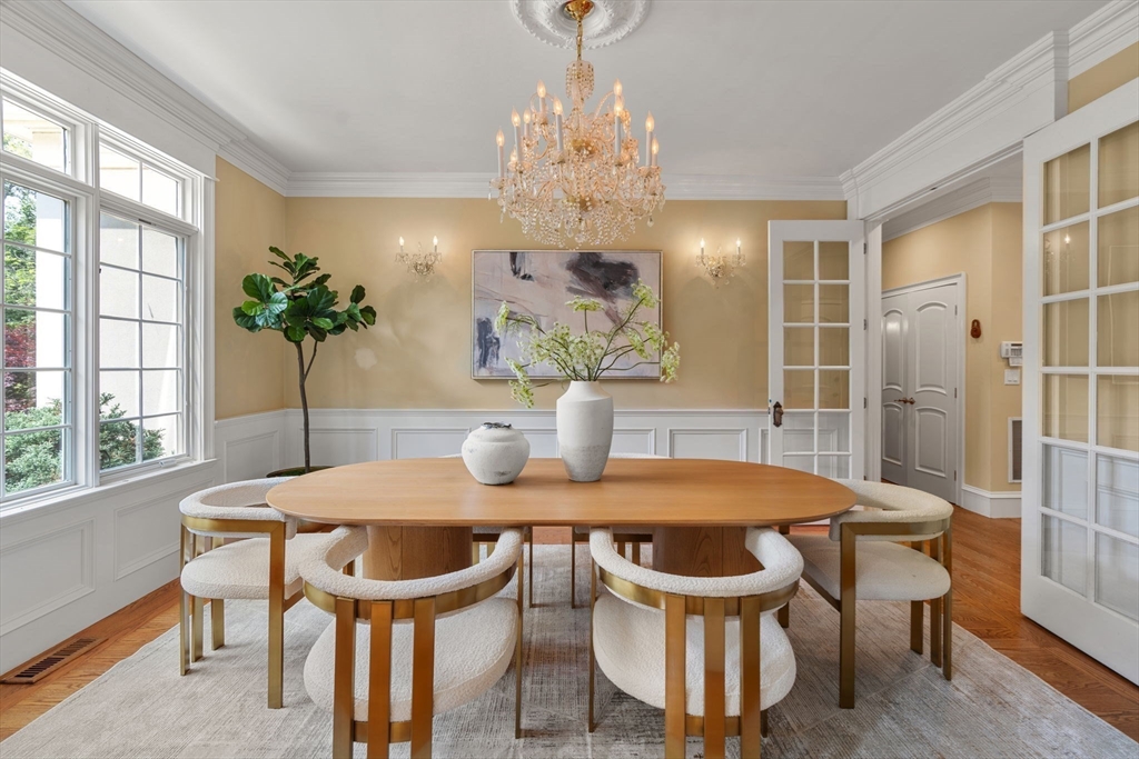 22 Scotney Road Newton, MA 02467 - Photo 12 of 42 a view of a dining room with furniture window and wooden floor
