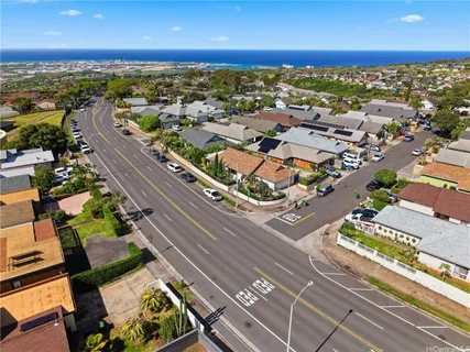 an aerial view of residential houses with outdoor space