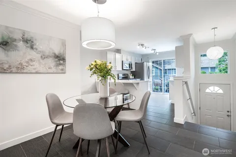 a dining room with furniture and window