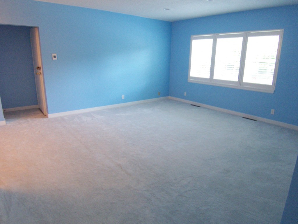 140 Lake Shore Road, Unit 1 Boston, MA 02135 - Photo 3 of 26 an empty room with a window