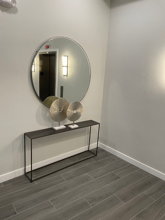 64 Market Street, Unit 401 Lynn, MA 01901 - Photo 11 of 14 a view of a livingroom with wooden floor
